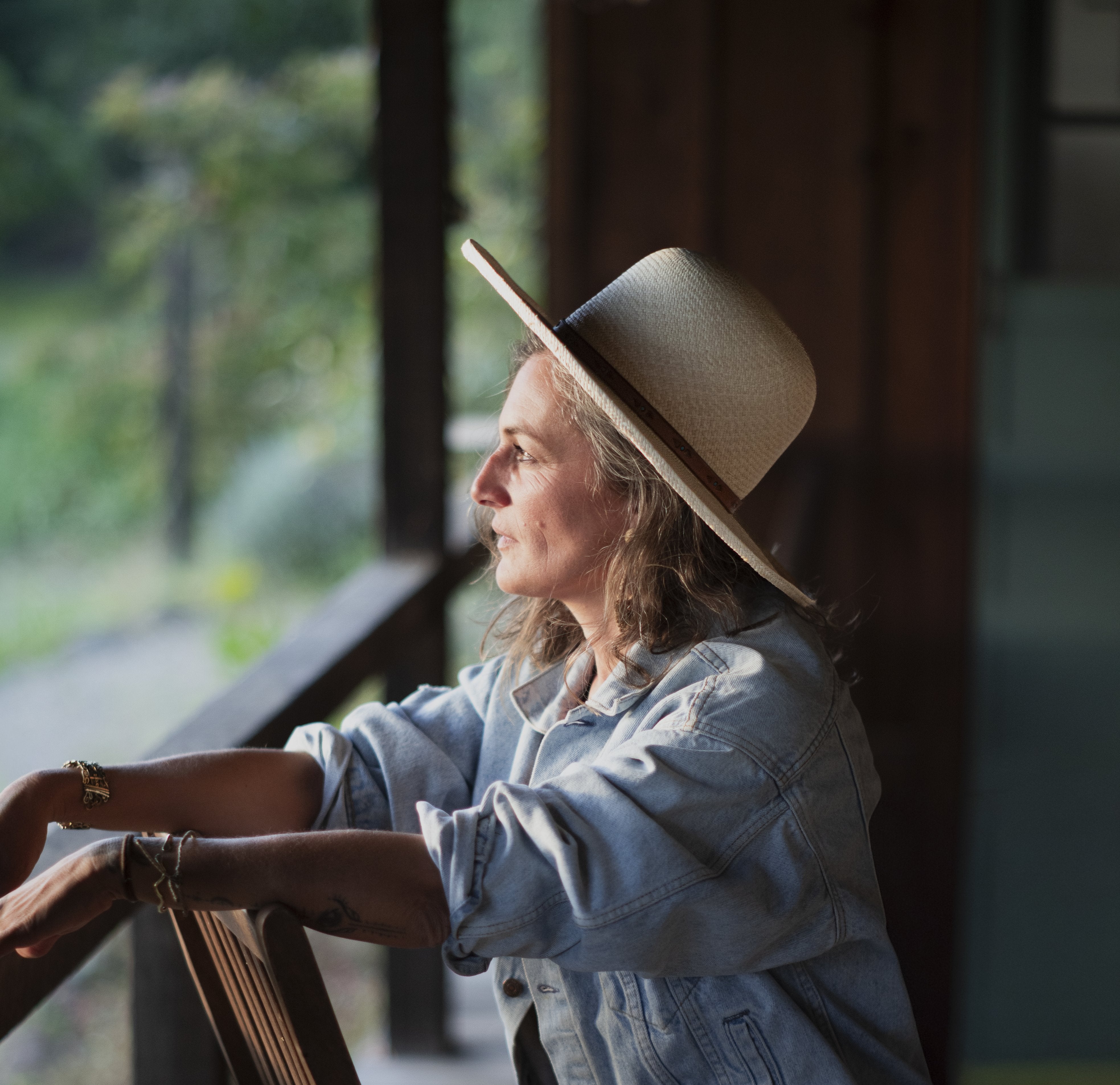 Four Winds hat styled outdoors, lifestyle setting.