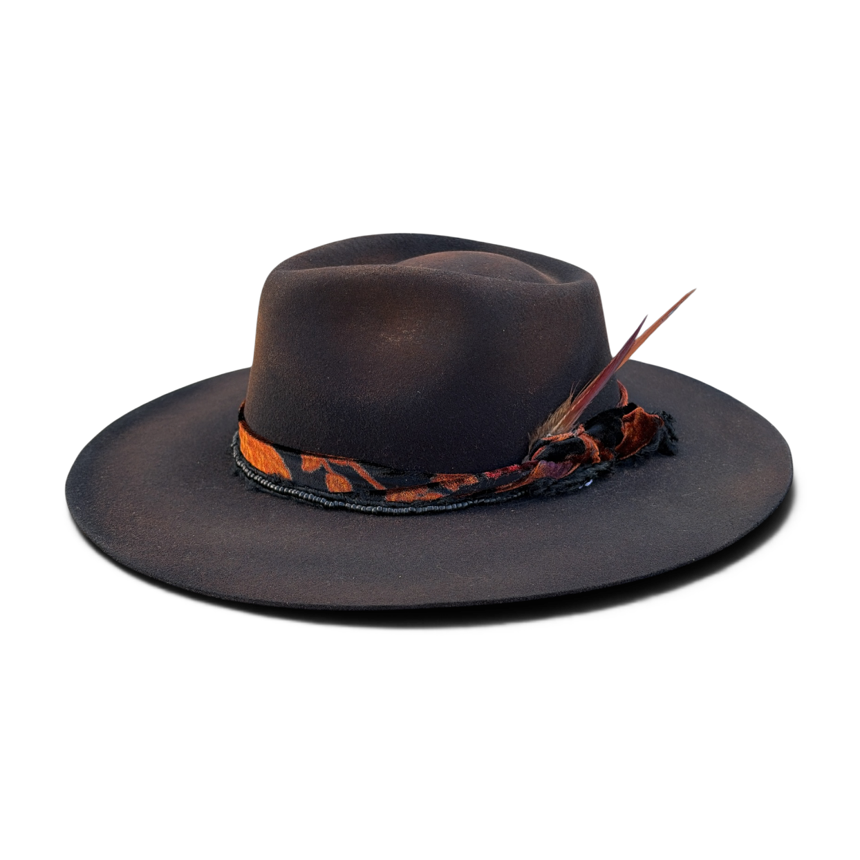 Nighthawk charred black felt teardrop fedora with rust velvet band and pheasant feather by Hampui Hats.