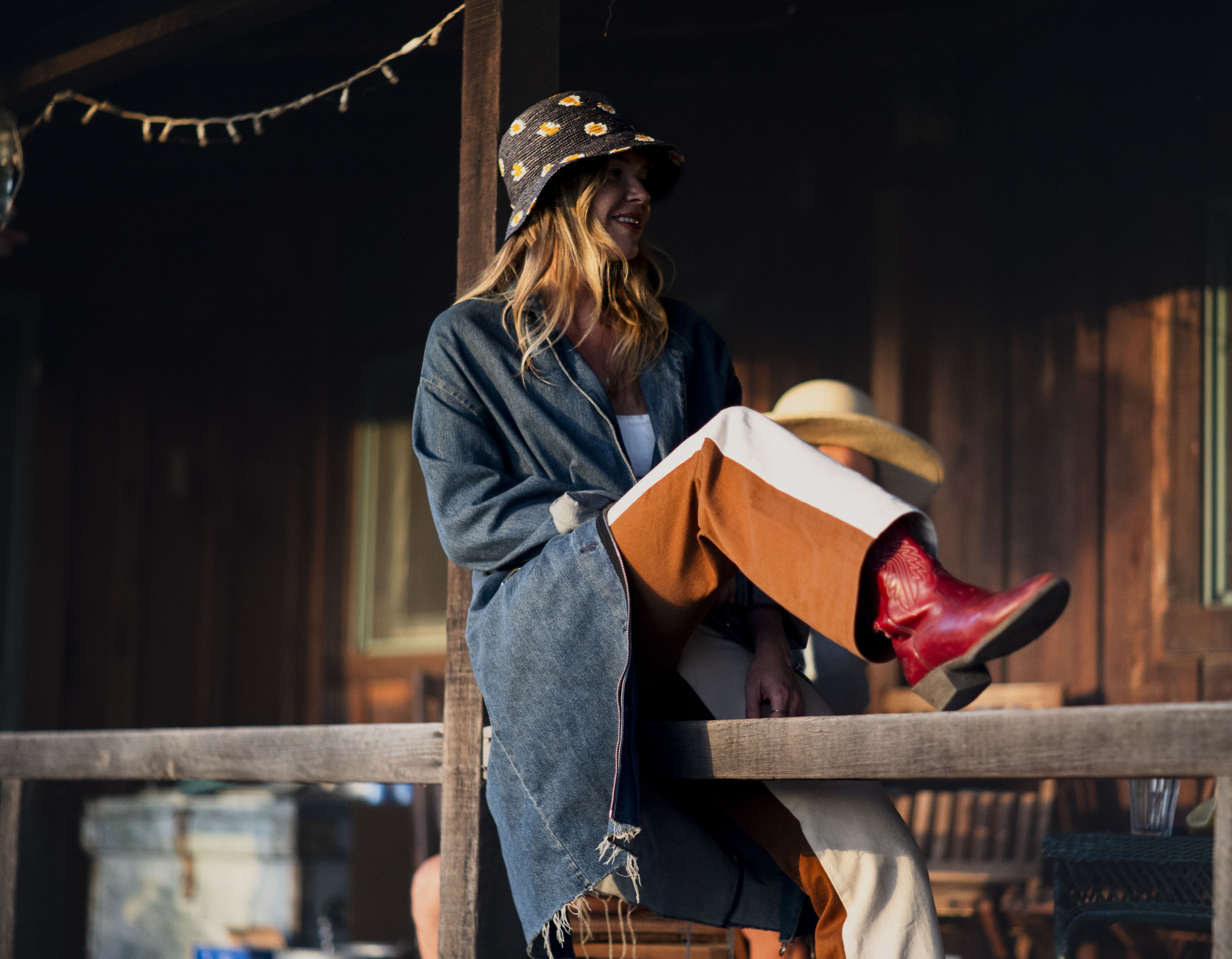 Nocturnal Straw Bucket hat styled outdoors, lifestyle setting.