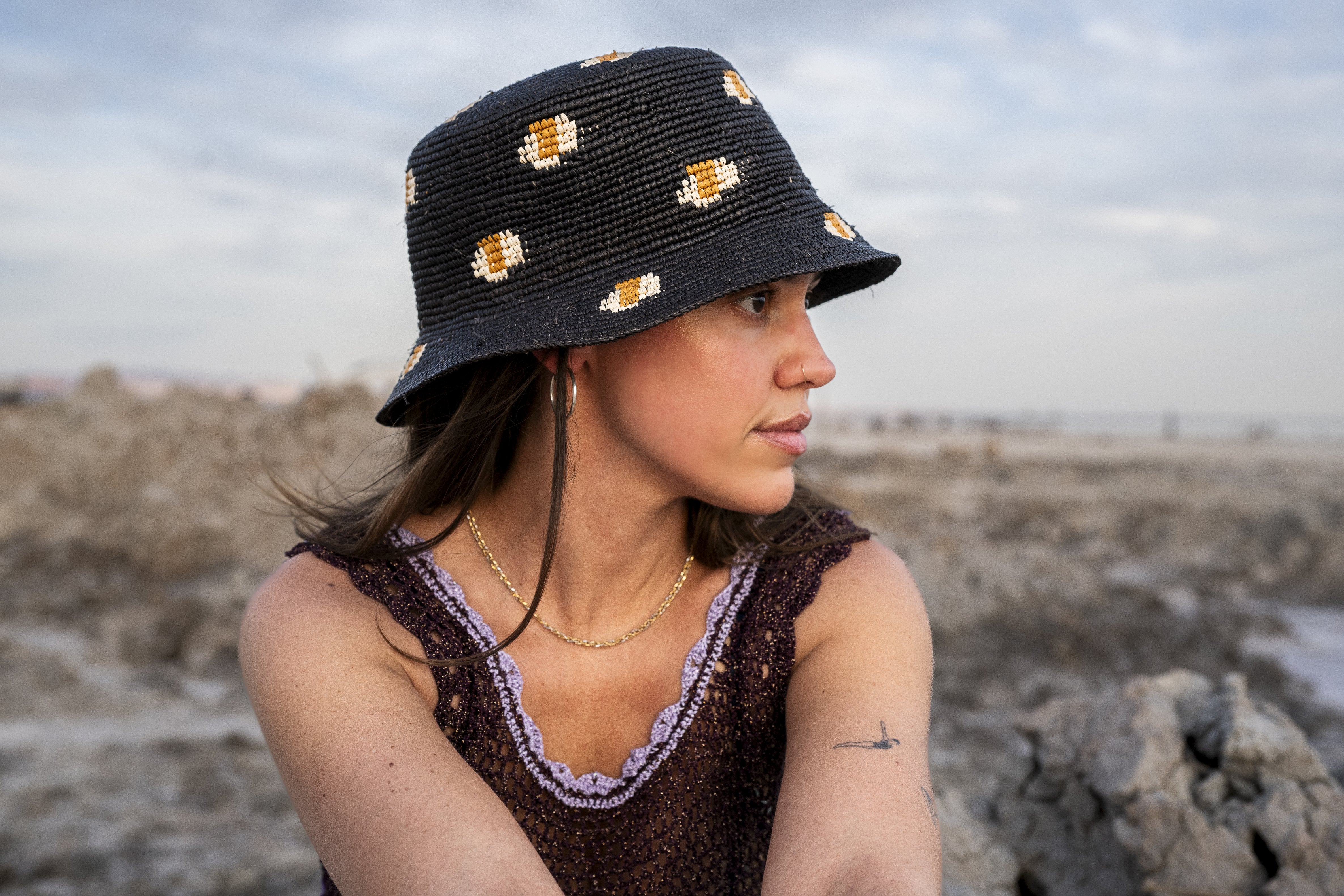 Nocturnal Straw Bucket hat worn by model, front view, Hampui Hats.