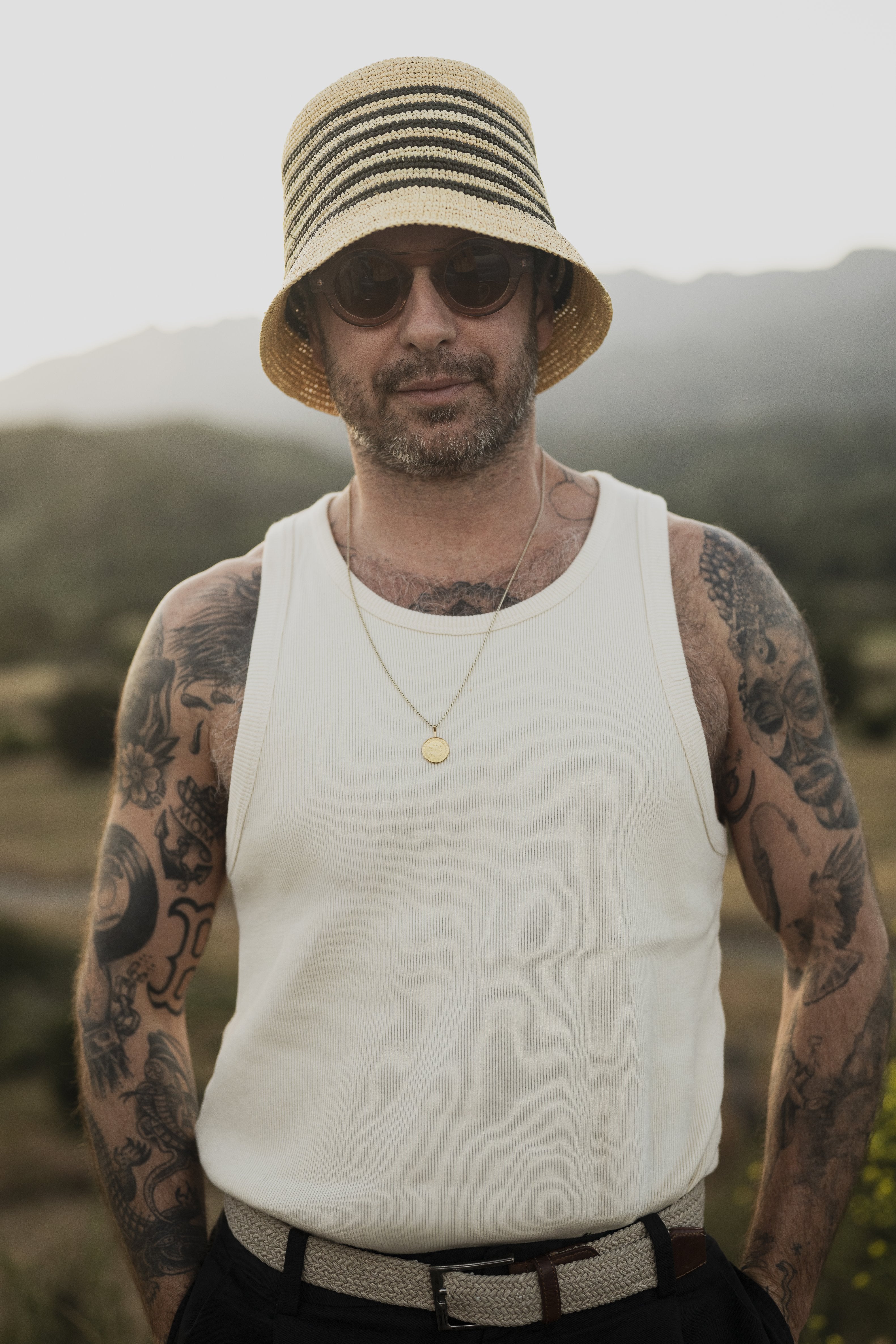 Racer Straw Bucket hat worn by model, front view, Hampui Hats.