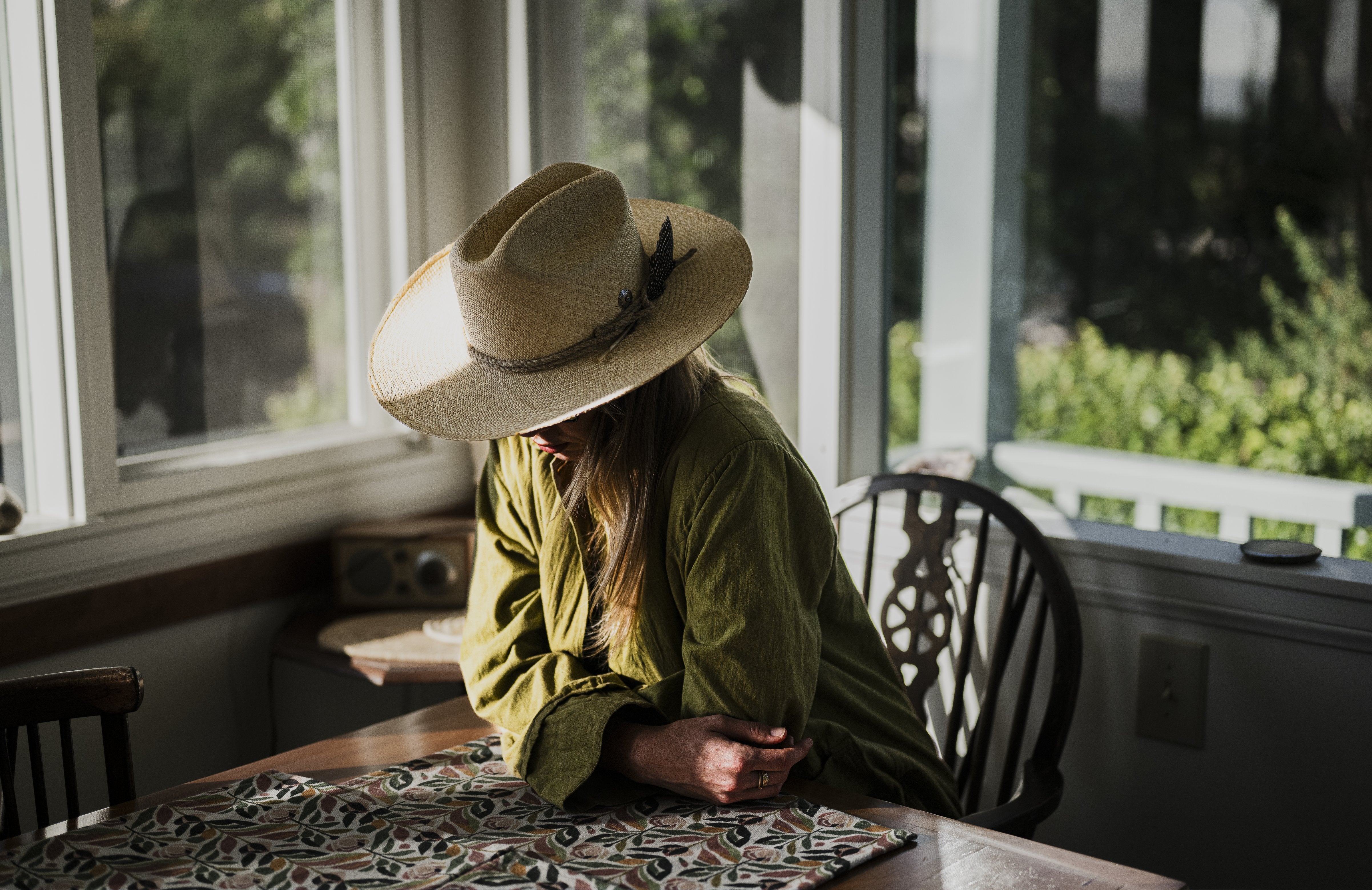 Sun in the Center hat styled outdoors, lifestyle setting.