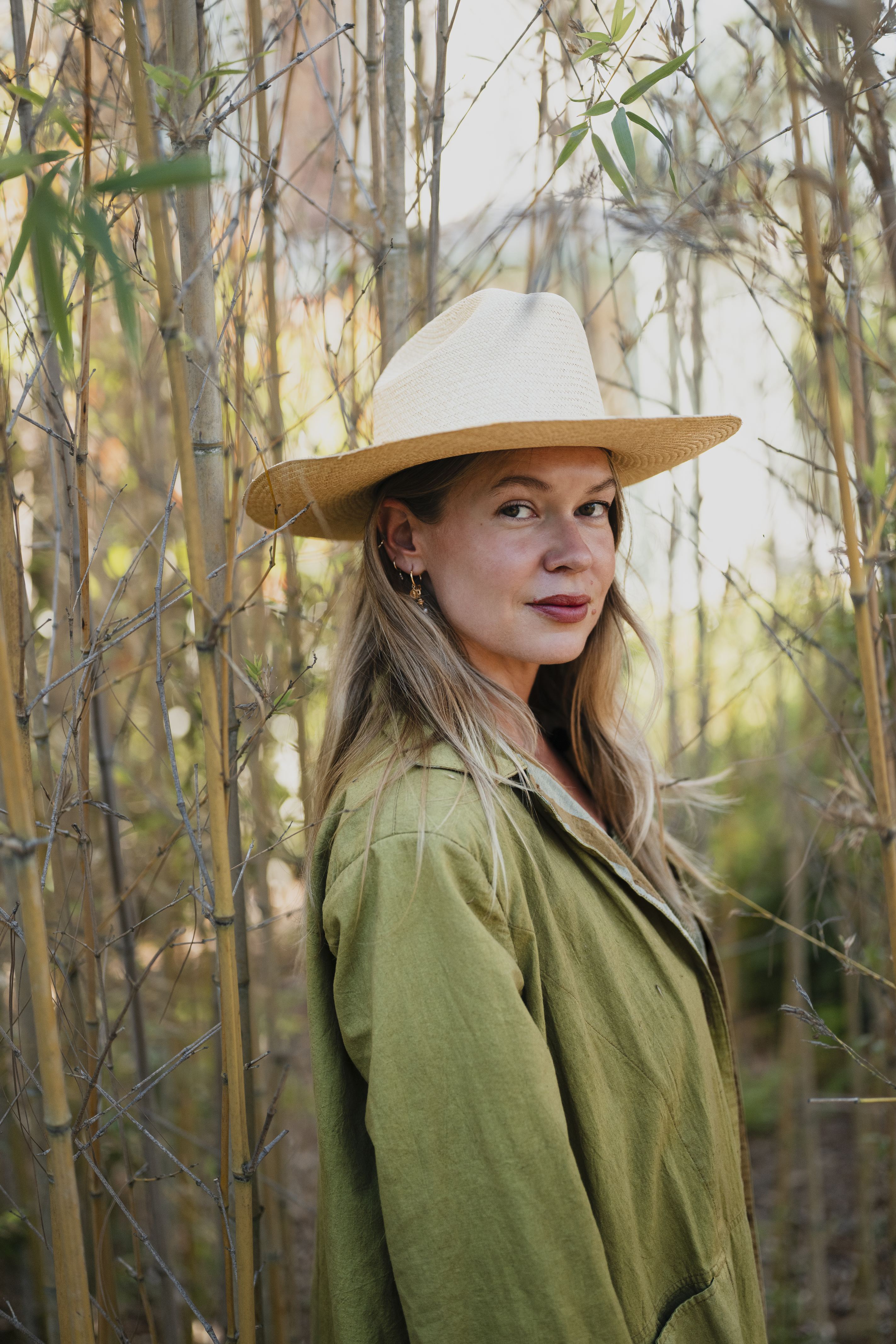 Sun in the Center hat worn by model, front view.
